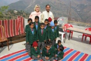 Lori, Kunwar, and students at GEMS
